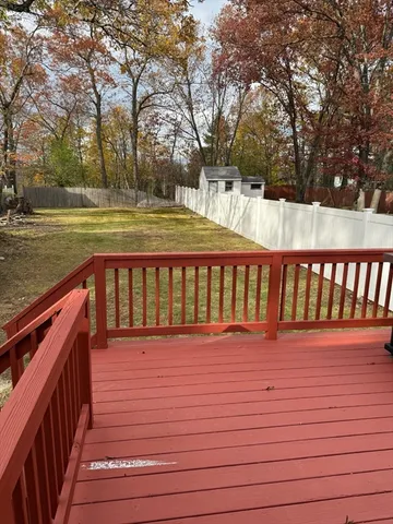 a view of a yard with snow on the road