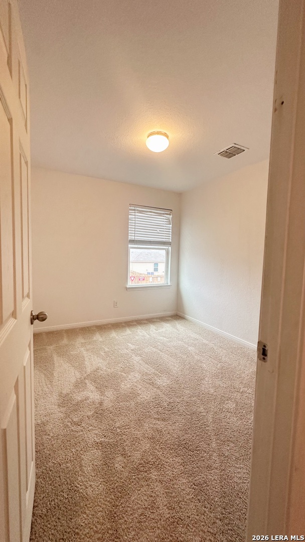 15230 Walcott Von Ormy, TX 78073 - Photo 7 of 10 an empty room with a window