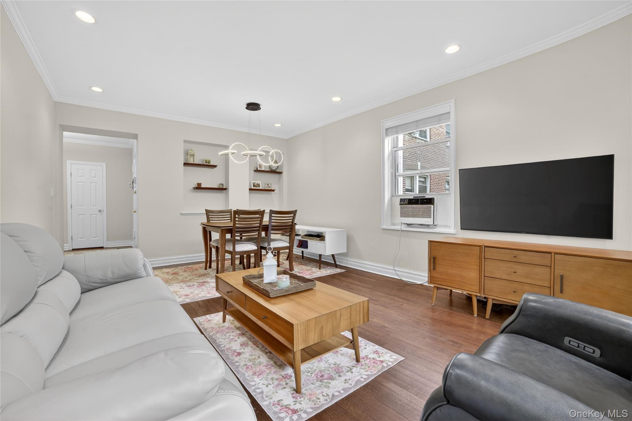 824 Palmer Road, Unit 1F Bronxville, NY 10708 - Photo 6 of 26 a living room with furniture and a flat screen tv