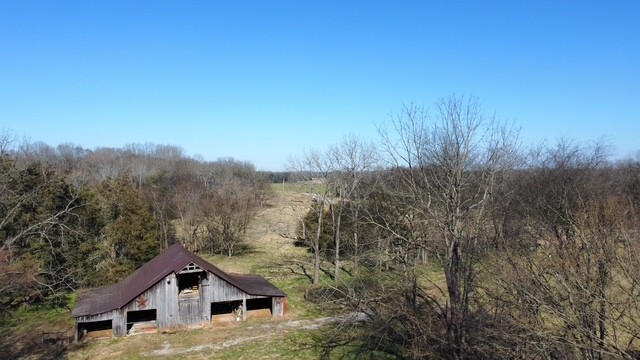 1 Pyles Road Chapel Hill, TN 37034 - Photo 30 of 32 a house with green field in front of it