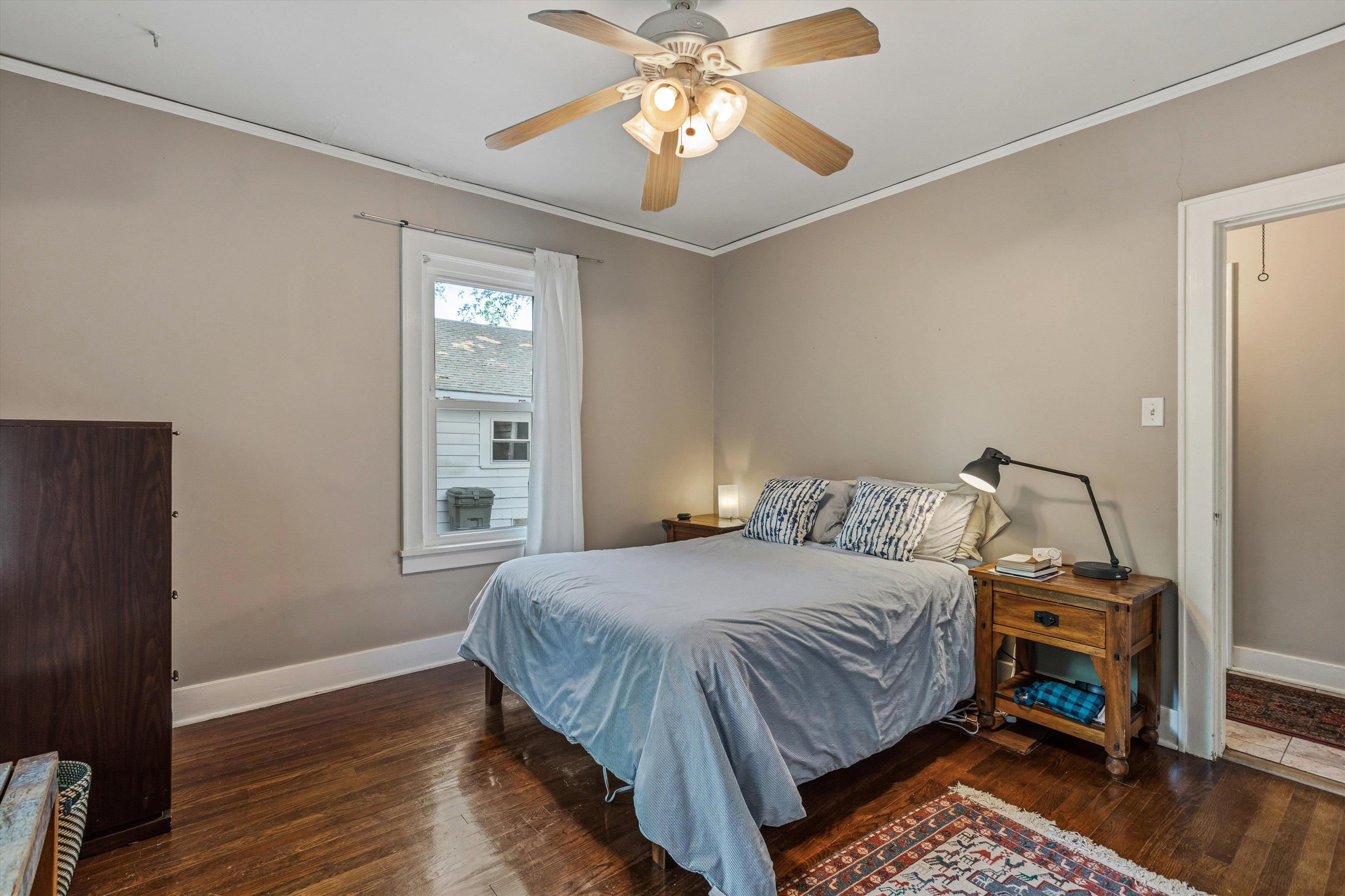 564 Alexander Street Memphis, TN 38111 - Photo 15 of 30 a bedroom with a bed and a chandelier