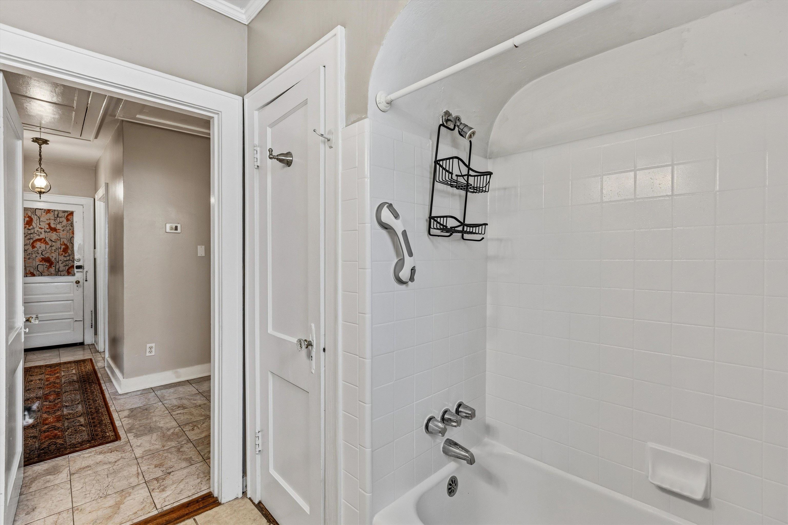 564 Alexander Street Memphis, TN 38111 - Photo 20 of 30 a bathroom with a tub and shower