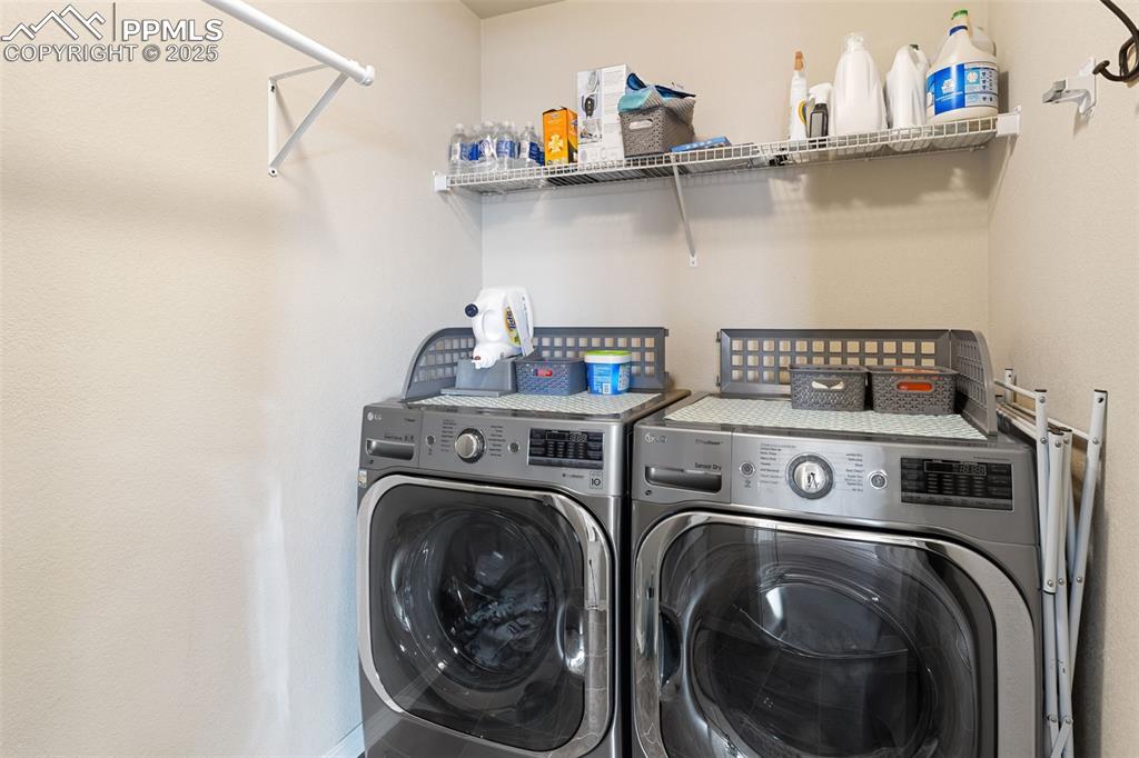 7228 New Meadow Drive Colorado Springs, CO 80923 - Photo 25 of 35 a utility room with dryer and washer