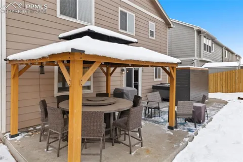 a patio with table and chairs