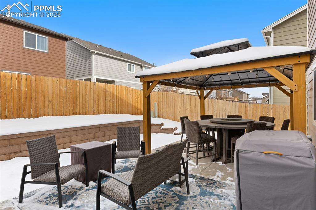 7228 New Meadow Drive Colorado Springs, CO 80923 - Photo 31 of 35 a view of a chairs and table in the patio
