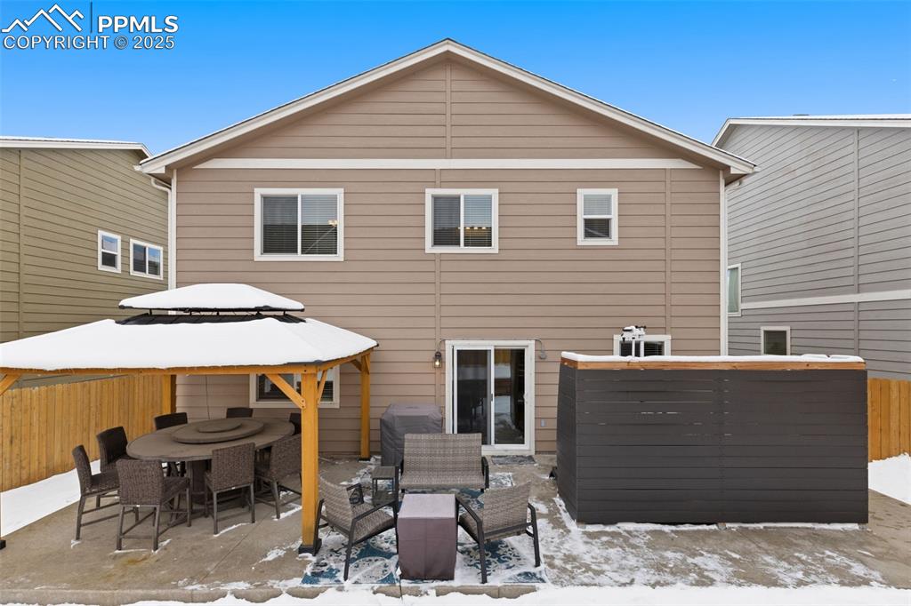 7228 New Meadow Drive Colorado Springs, CO 80923 - Photo 32 of 35 a backyard of a house with table and chairs