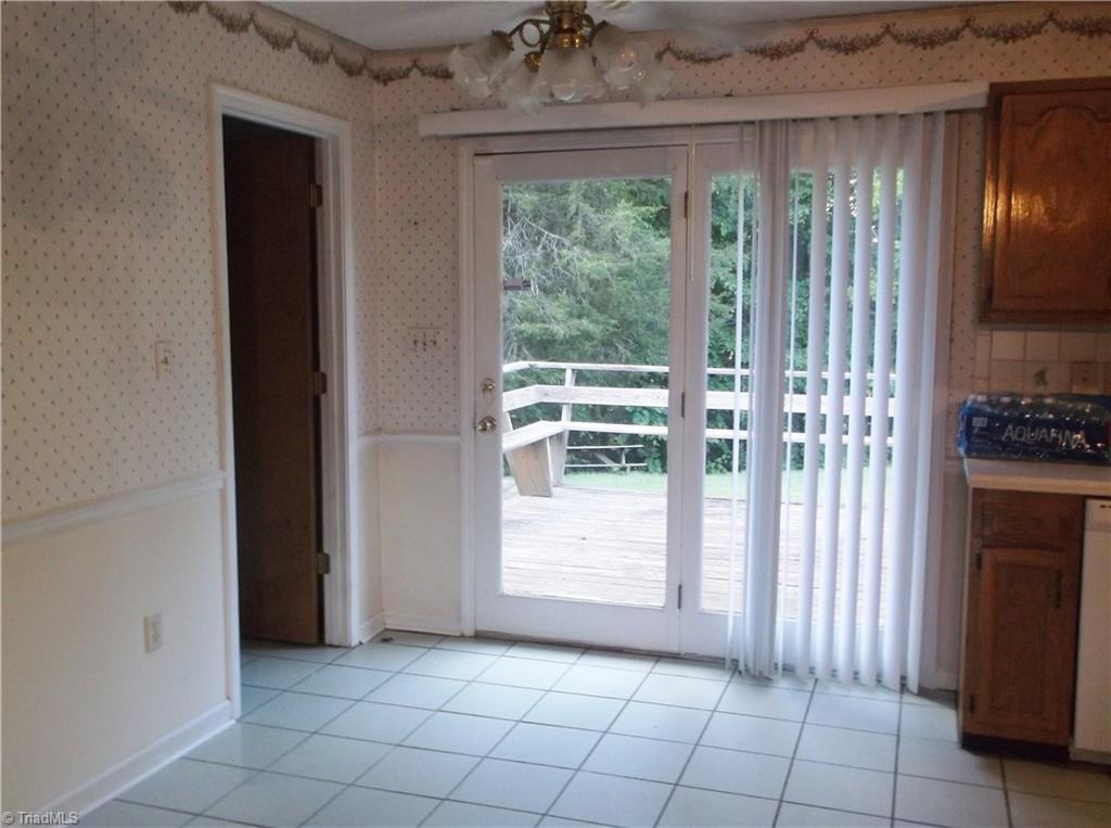 1099 Edwards Road Rural Hall, NC 27045 - Photo 14 of 20 Dining Area with door leading out onto the deck, door to left leads to the laundry room.