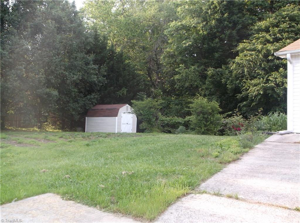 1099 Edwards Road Rural Hall, NC 27045 - Photo 7 of 20 Storage building, garden area and grape vines.