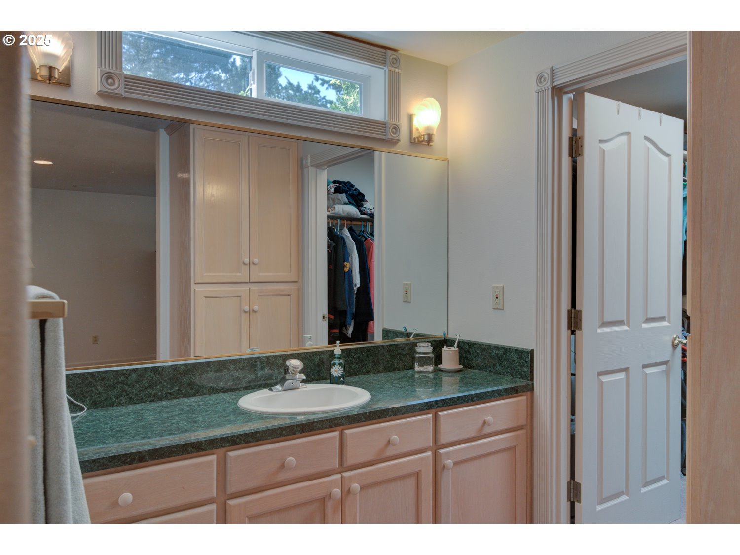 87630 Woodmere East Florence, OR 97439 - Photo 14 of 25 a bathroom with a granite countertop sink and a mirror