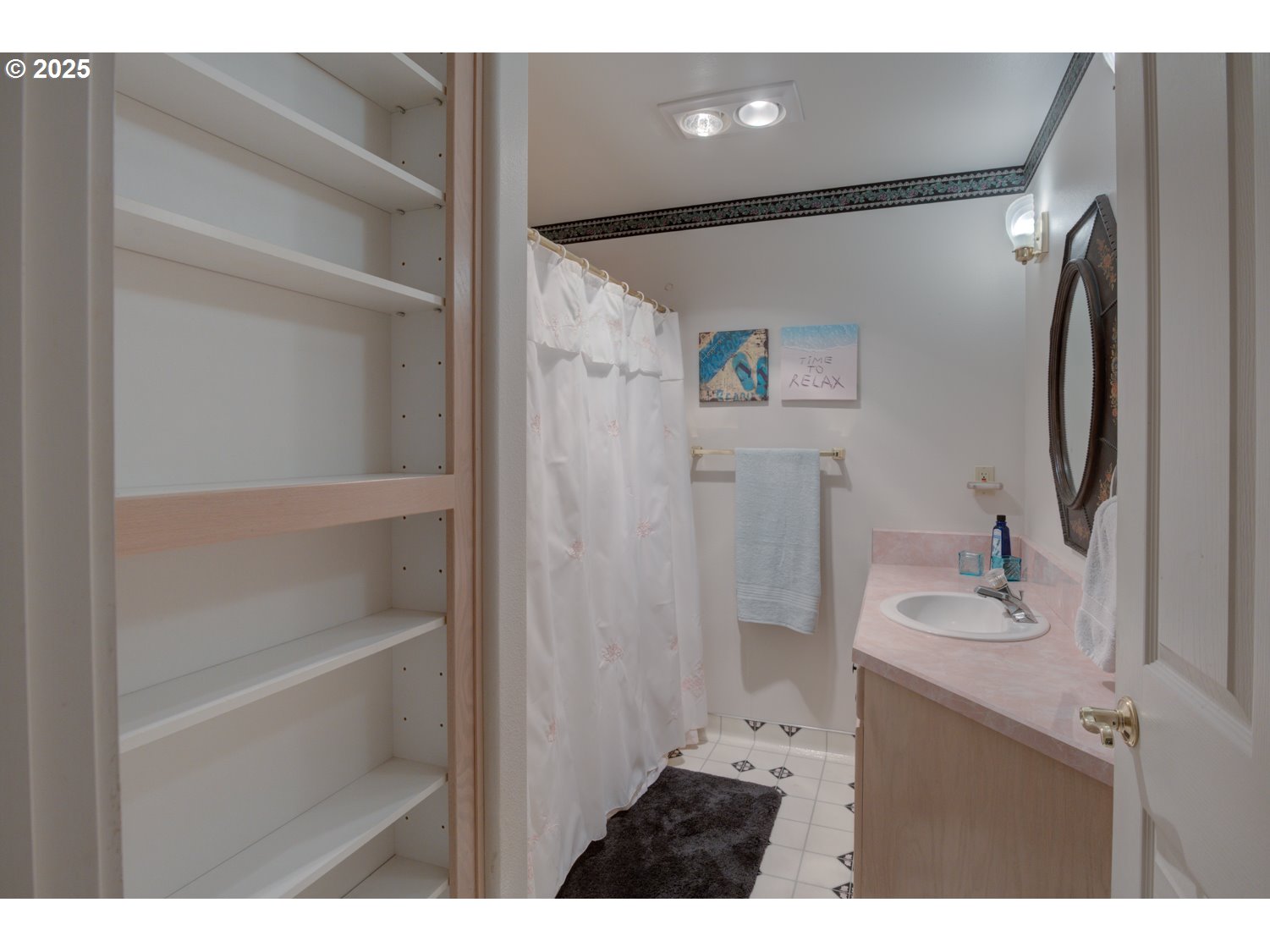 87630 Woodmere East Florence, OR 97439 - Photo 19 of 25 a bathroom with a sink vanity and a mirror