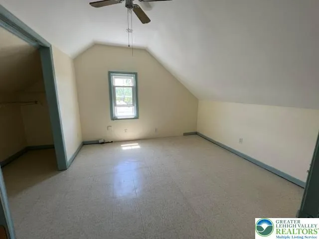 an empty room with a empty space and windows