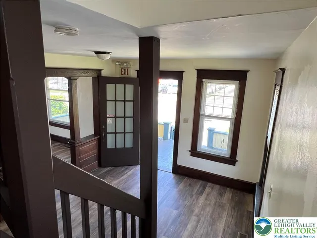 workspace with wooden floor and windows