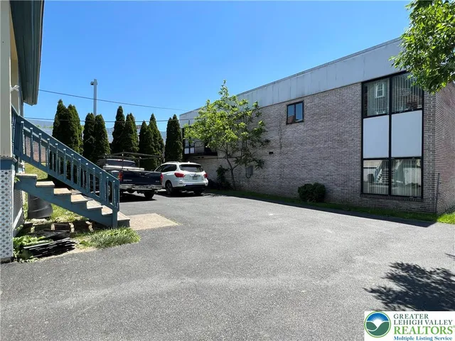 a view of street with parked cars