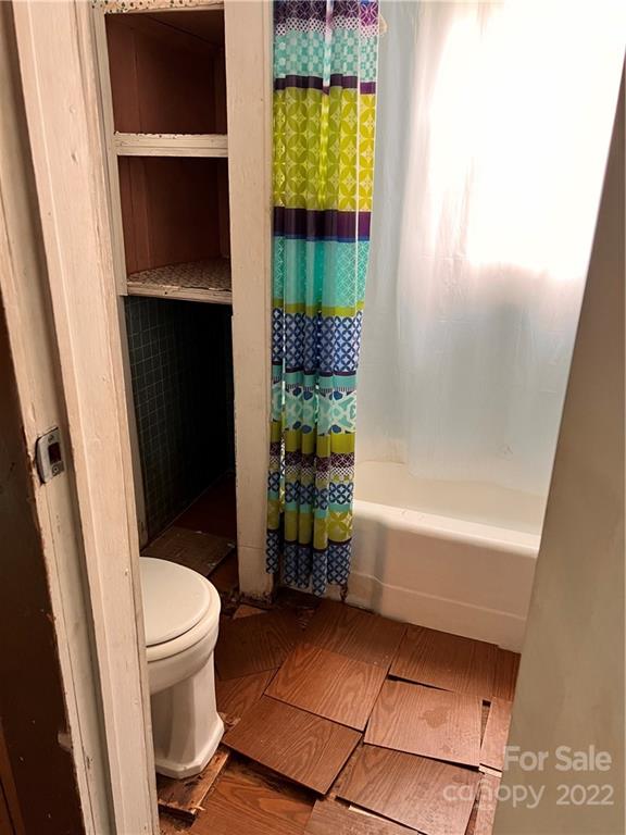 4080 Piney Road Morganton, NC 28655 - Photo 15 of 26 a bathroom with a toilet and a shower