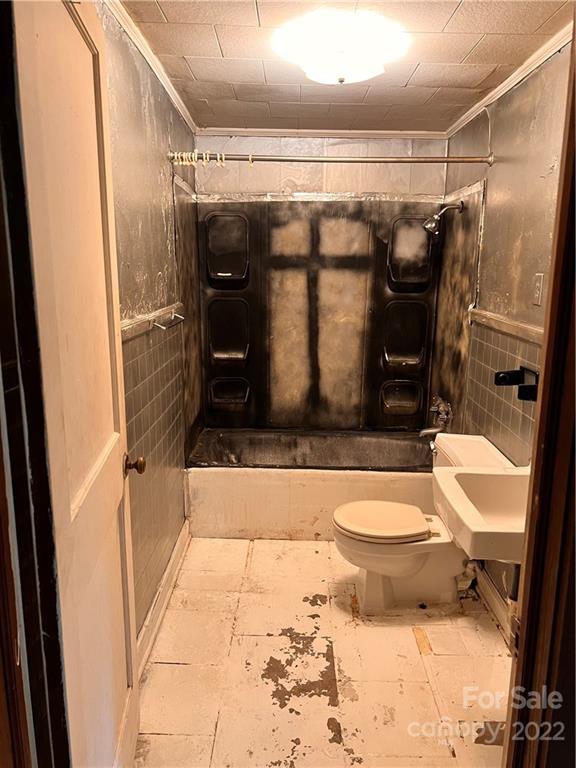 4080 Piney Road Morganton, NC 28655 - Photo 19 of 26 a bathroom with a sink toilet and shower