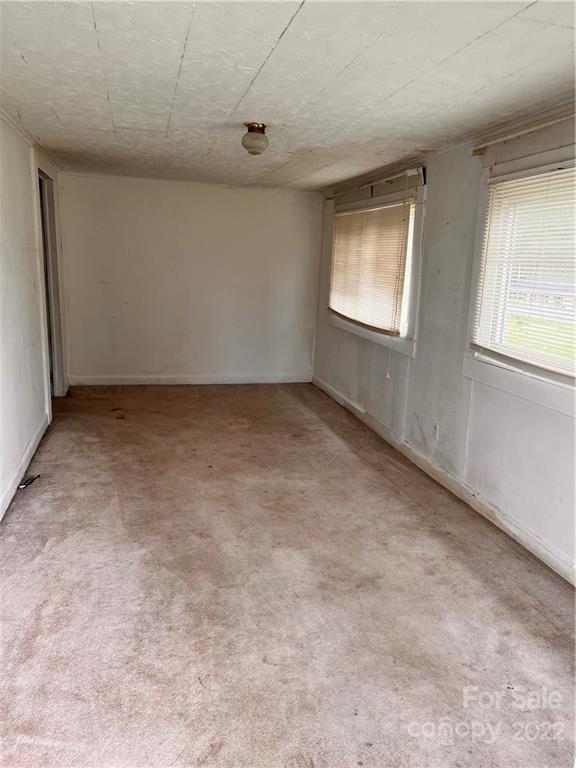4080 Piney Road Morganton, NC 28655 - Photo 20 of 26 an empty room with windows