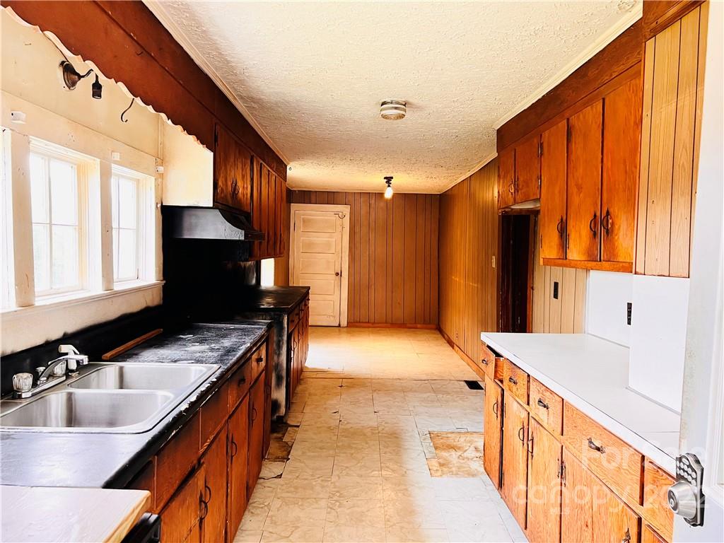 4080 Piney Road Morganton, NC 28655 - Photo 10 of 26 a bathroom with a sink double vanity and a bathtub