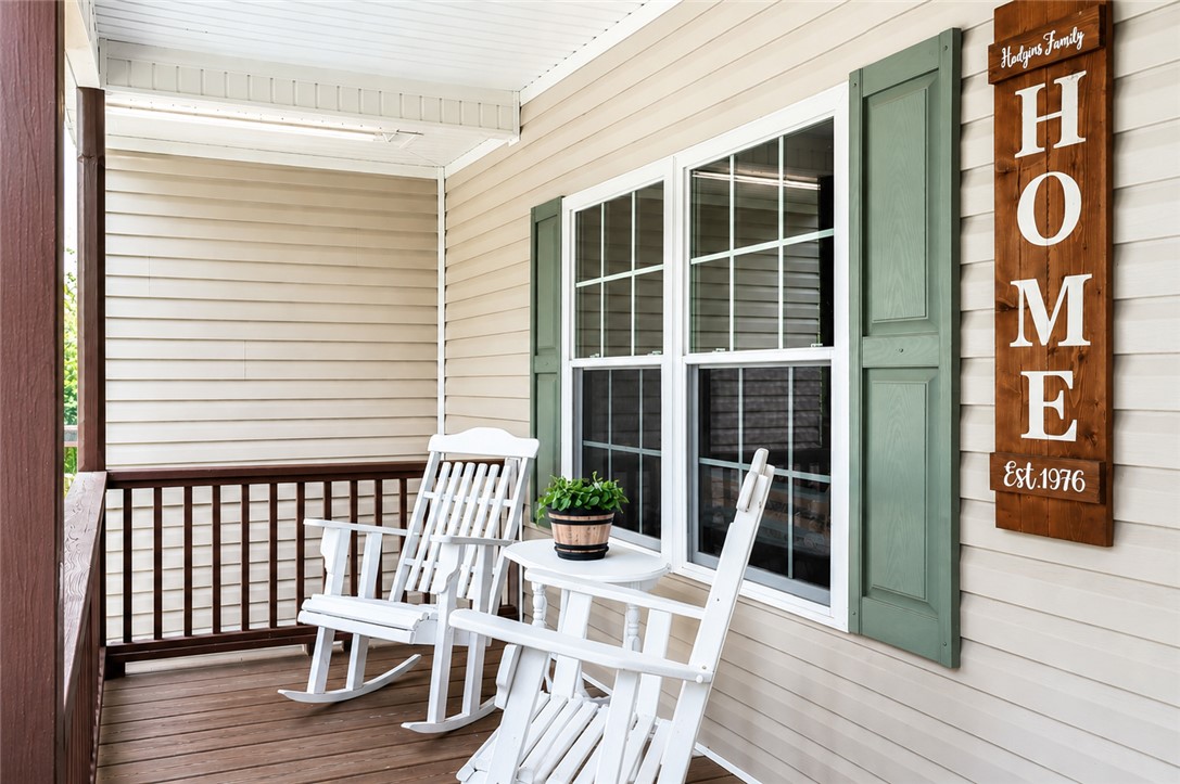 190 Fred Bradford Road Iva, SC 29655 - Photo 4 of 32 This inviting porch offers a tranquil retreat with classic rocking chairs and ample natural light.
