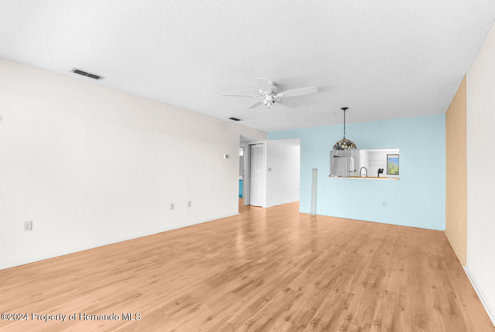 7721 Cosme Drive Hudson, FL 34667 - Photo 15 of 28 a view of empty room with wooden floor