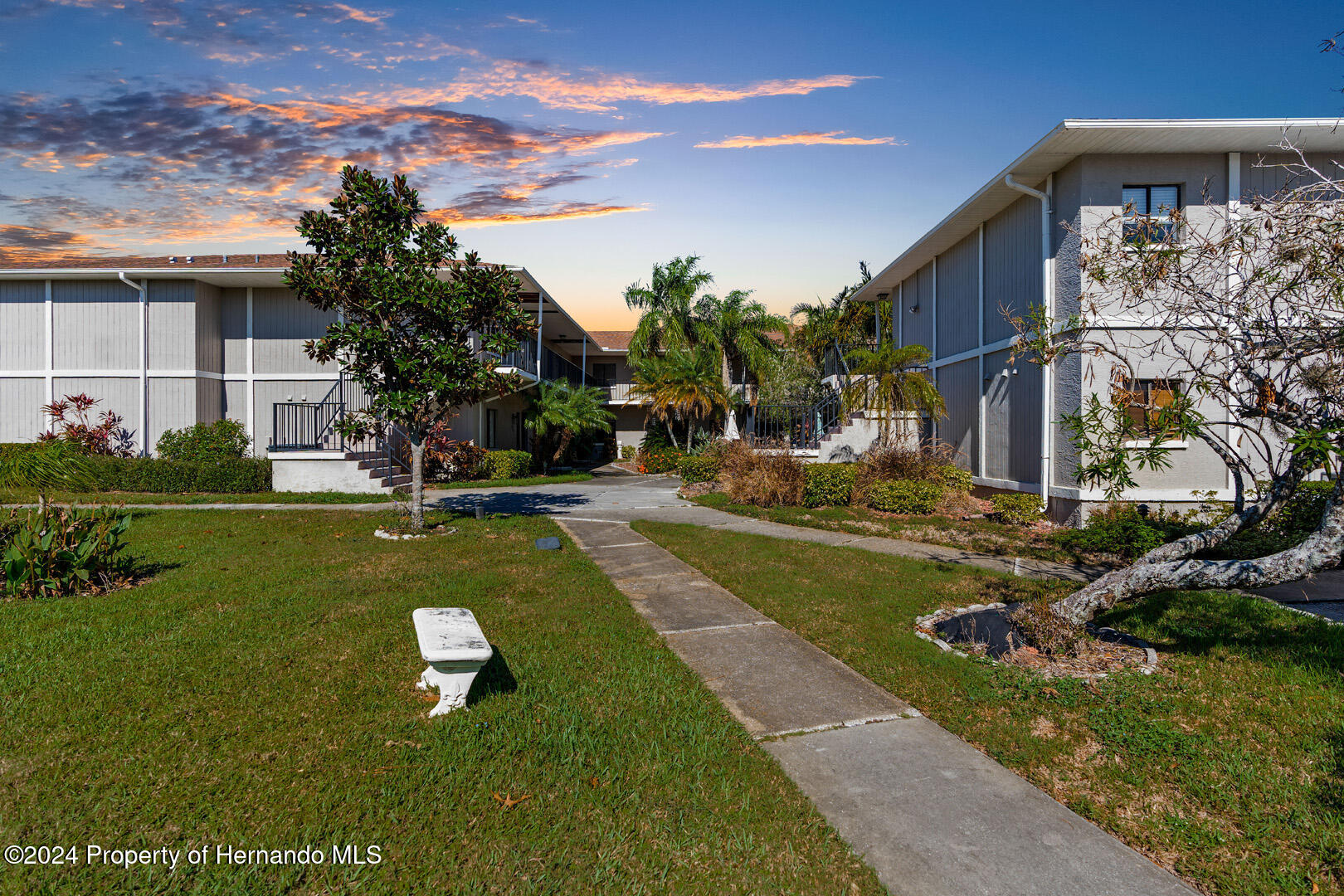 7721 Cosme Drive Hudson, FL 34667 - Photo 2 of 28 a view of a house with a yard