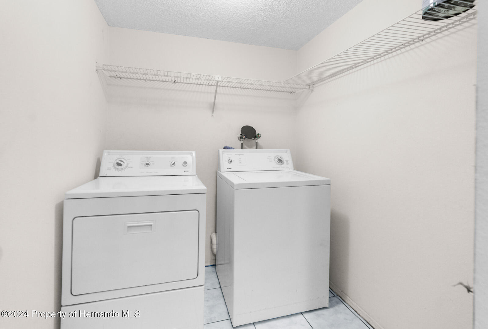 7721 Cosme Drive Hudson, FL 34667 - Photo 22 of 28 a utility room with dryer and washer