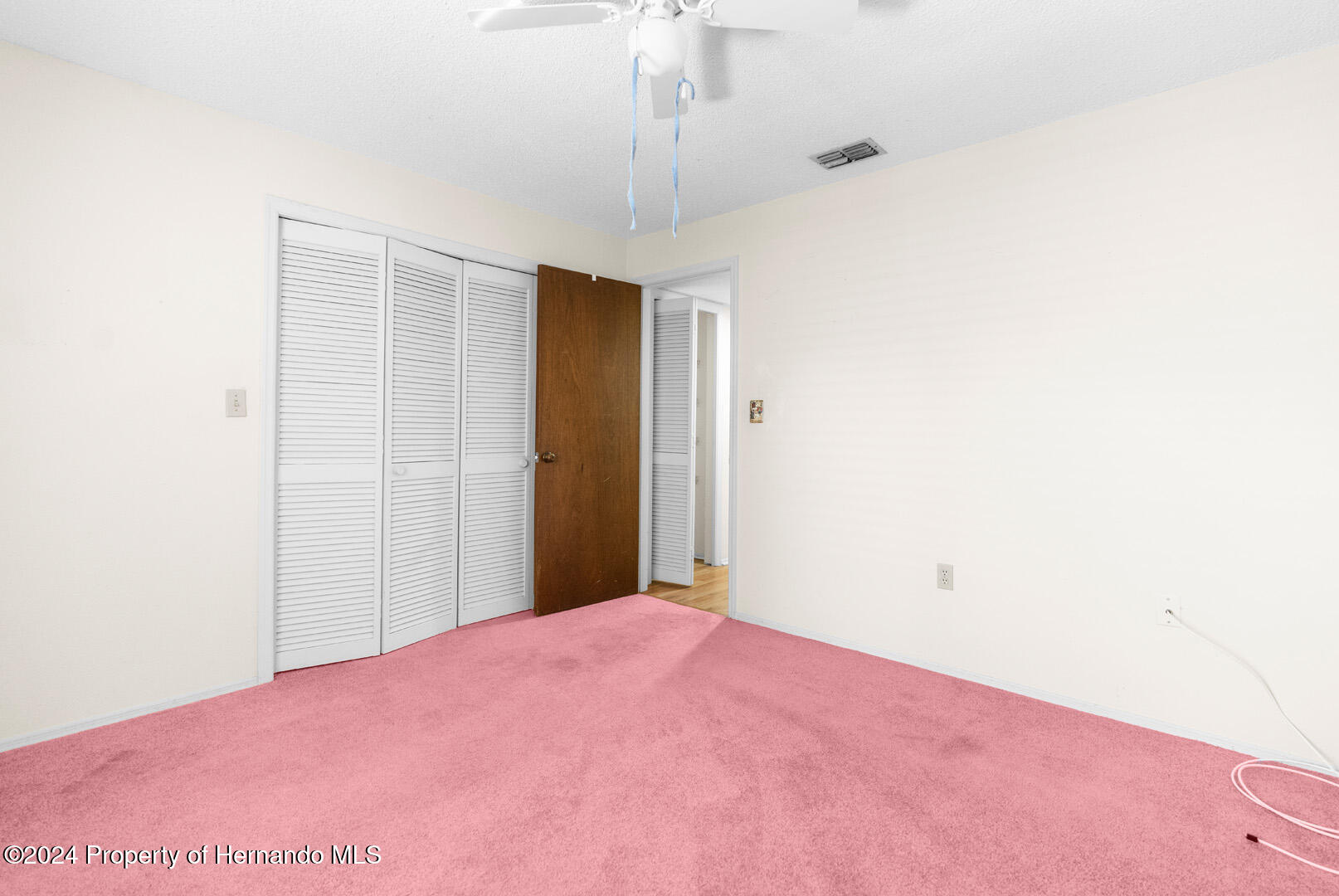7721 Cosme Drive Hudson, FL 34667 - Photo 25 of 28 a view of a room with a ceiling fan
