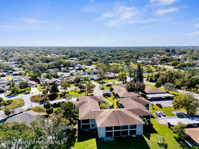 an aerial view of a city with lots of residential buildings