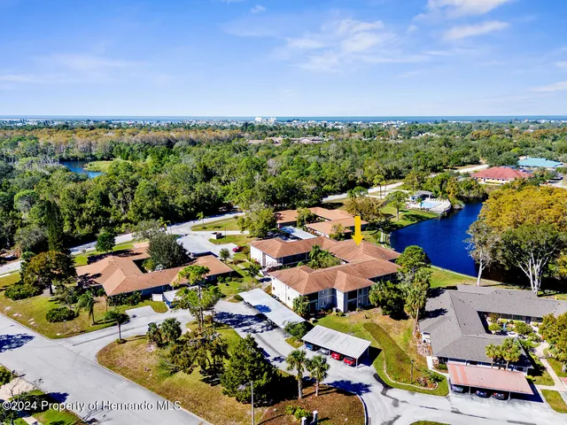 an aerial view of a houses with outdoor space
