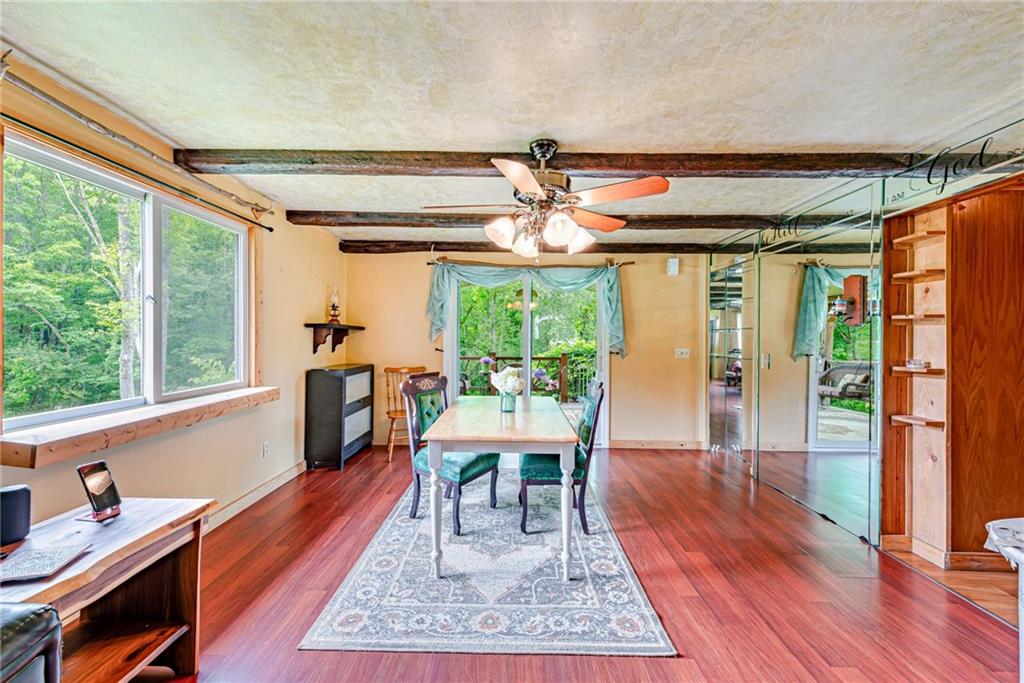 174 Keffer Road Dawson, PA 15428 - Photo 12 of 28 a dining room with large window and wooden floor