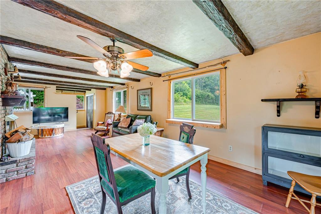 174 Keffer Road Dawson, PA 15428 - Photo 14 of 28 a living room with furniture a table and wooden floor