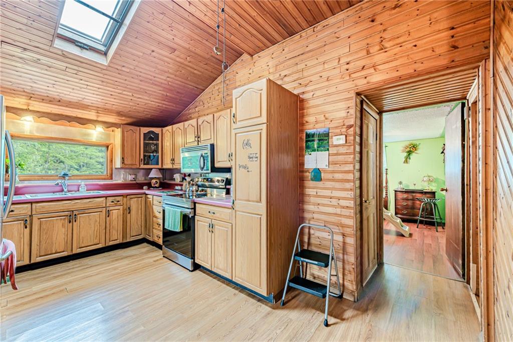 174 Keffer Road Dawson, PA 15428 - Photo 15 of 28 a kitchen with cabinets and wooden floor