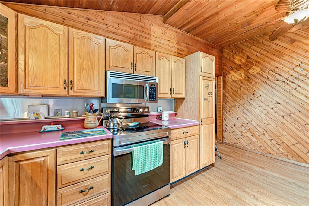 174 Keffer Road Dawson, PA 15428 - Photo 18 of 28 a kitchen with stainless steel appliances a stove microwave and refrigerator