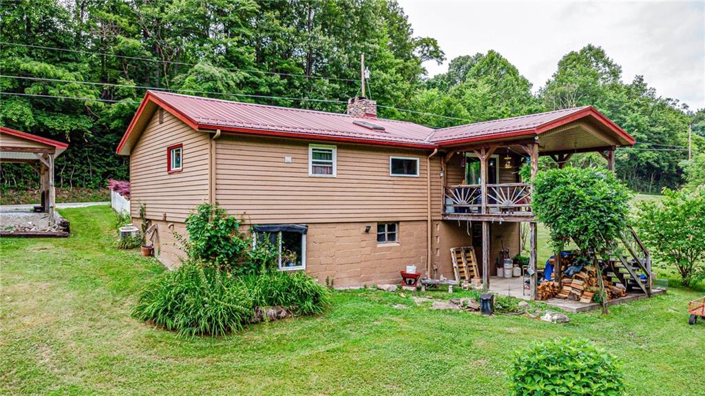 174 Keffer Road Dawson, PA 15428 - Photo 4 of 28 a front view of a house with a garden