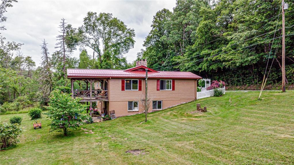 174 Keffer Road Dawson, PA 15428 - Photo 5 of 28 a view of a house with a yard