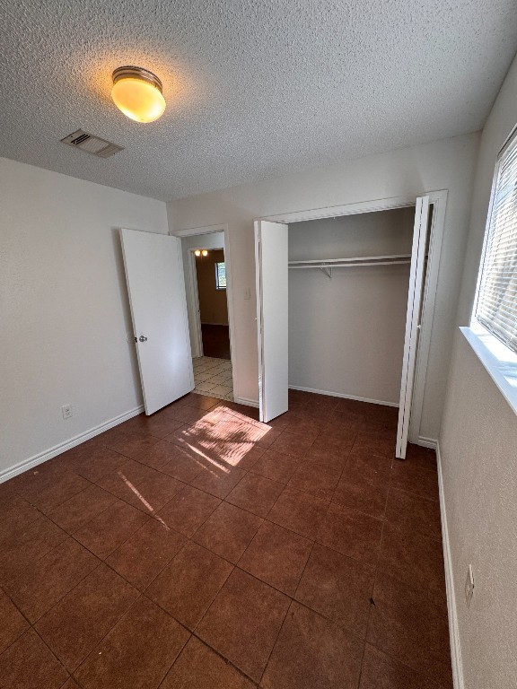11405 Ptarmigan Drive, Unit A Austin, TX 78758 - Photo 13 of 20 a view of room with window and wooden floor