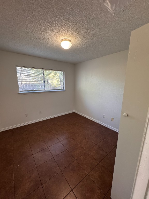11405 Ptarmigan Drive, Unit A Austin, TX 78758 - Photo 14 of 20 an empty room with windows