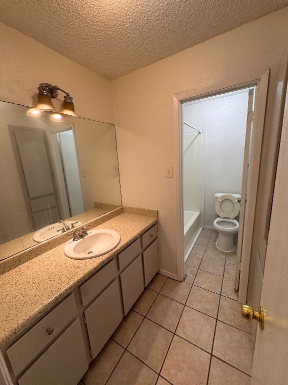 11405 Ptarmigan Drive, Unit A Austin, TX 78758 - Photo 19 of 20 a bathroom with a granite countertop sink and a mirror