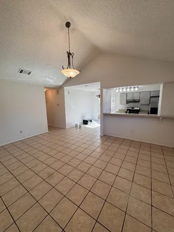 a view of a kitchen with a sink cabinets and window