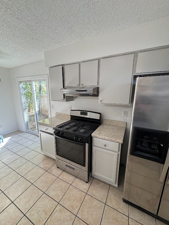 11405 Ptarmigan Drive, Unit A Austin, TX 78758 - Photo 8 of 20 a kitchen with granite countertop a sink stove and cabinets