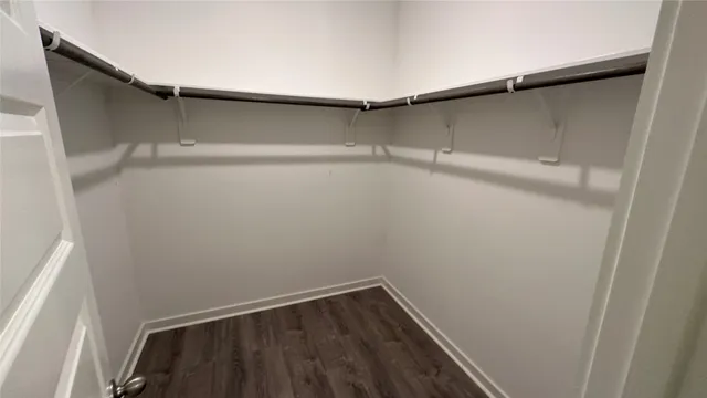 a view of an empty walk in closet