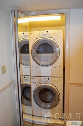 596 Old Post Road Edison, NJ 08817 - Photo 11 of 13 a utility room with dryer and washer