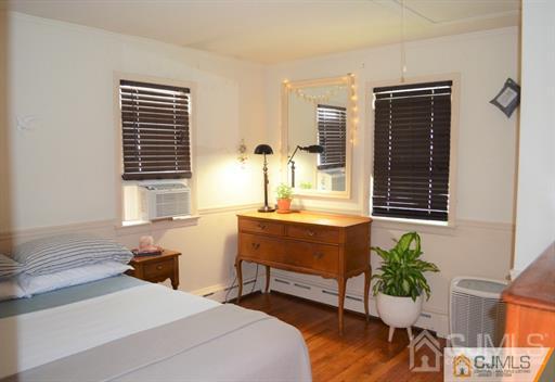 596 Old Post Road Edison, NJ 08817 - Photo 4 of 13 a bedroom with a bed potted plant and a window