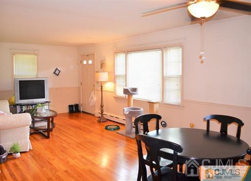 596 Old Post Road Edison, NJ 08817 - Photo 6 of 13 a view of a dining room with furniture and a window