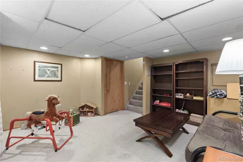 a bedroom with furniture and a flat screen tv