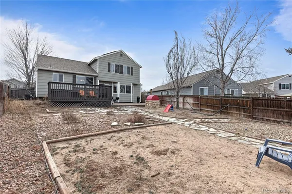 a view of a house with a yard and seating space