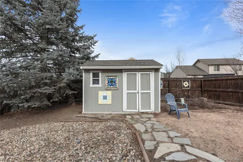 a view of a backyard with sitting area