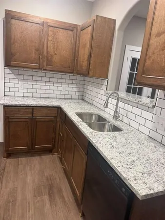 a stove top oven sitting inside of a kitchen