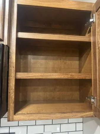 a kitchen with granite countertop a sink and a stove