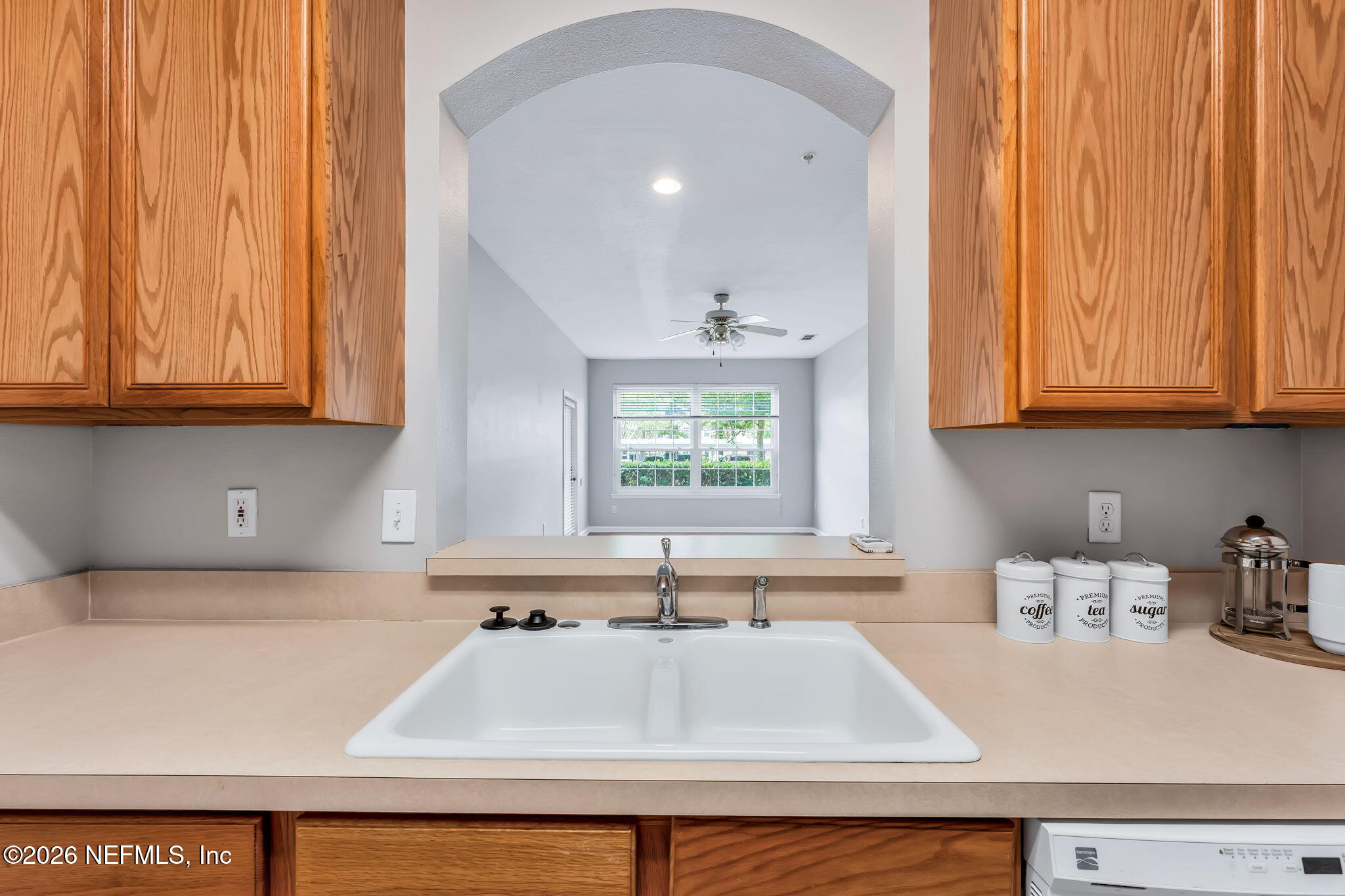 7990 Baymeadows Road East, Unit 520 Jacksonville, FL 32256 - Photo 10 of 41 a kitchen with stainless steel appliances granite countertop a sink a window and cabinets