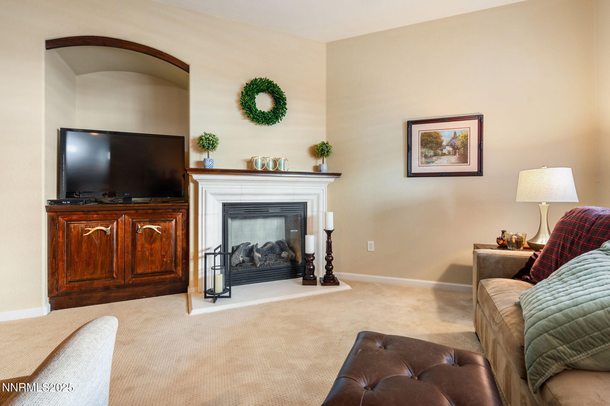 9900 Wilbur May Parkway, Unit 906 Reno, NV 89521 - Photo 16 of 44 a living room with furniture and a flat screen tv